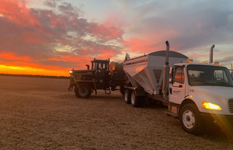 Setterington's Bulk Delivery Trucks with sunrise in the background